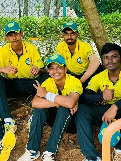 Players relax under a tree during a break in play on their Chennai tour.