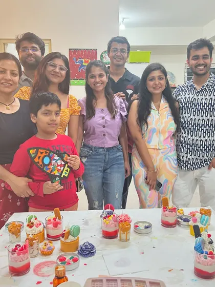 A family and friends group photo after a fun and creative candle making session.