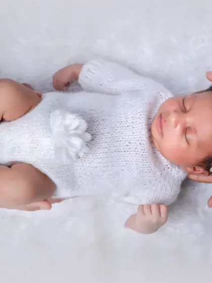 From two to three, love just got brighter. This creative shot symbolizes the hands that will guide this little one.