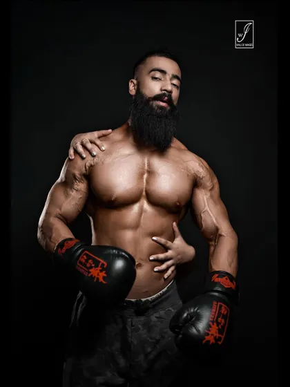 Another artistic shot from the boxing series, this one with a more contemplative expression. The lighting and composition create a high-fashion feel, suitable for editorial use or a unique portfolio piece.