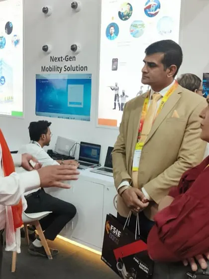 My team member, draped in the tiranga, explaining our next-gen mobility solutions to interested visitors at FSIE 2025. Every conversation is an opportunity to share our vision for a secure India.