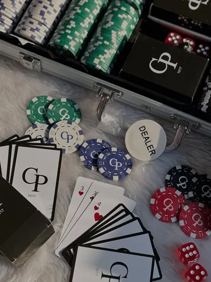 Details of the personalized poker set. You can see the custom initials on the cards and chips, making it a truly one-of-a-kind gift for the newlyweds.