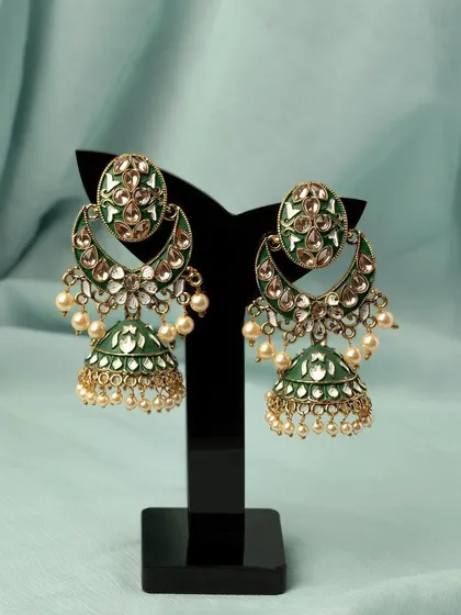 A color variation of the traditional jhumka earrings, showcasing the green enamel work. Offering photos of all available colors is key to a good online shopping experience.