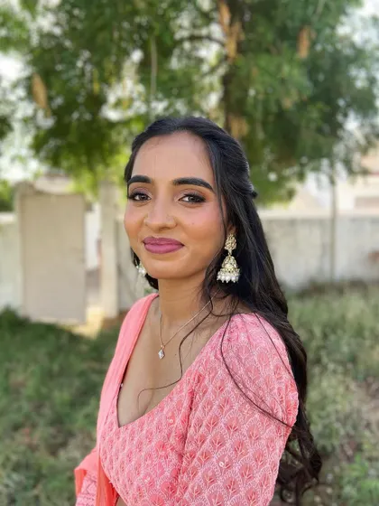 A beautiful, smiling portrait of the client, looking fresh and radiant in the natural sunlight.