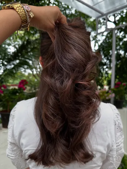 The ponytail test for her first hair color, showing the subtle dimension.
