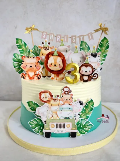 Calling all party animals! A simple yet adorable jungle cake using printed edible toppers for a clean and vibrant look.