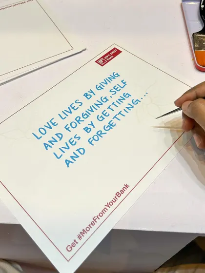 A close-up of one of the personalized artworks from the IDFC First Bank event. The process involved revealing a message with invisible ink before illustrating a story around it.