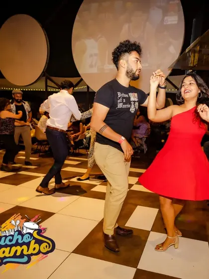 Another great shot from our weekly social dancing event. The checkered floor, the music, and the smiles say it all.