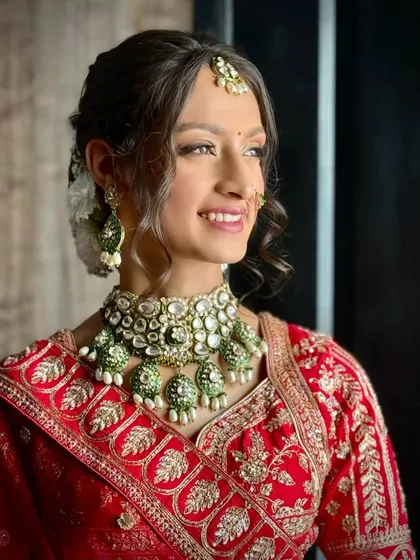 A bright and happy bridal portrait, where the soft glam makeup enhances her natural smile and glowing skin.