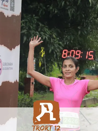 Raising my arms at the finish line. Every finish, no matter the time, is a victory to be celebrated.