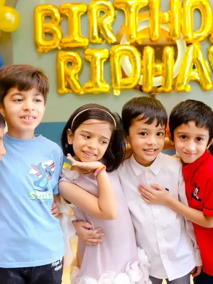 A group of friends posing for a photo at a birthday party. We capture the friendships and fun that make these events so special for kids.