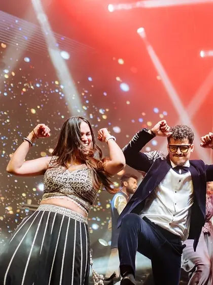 The pure joy of a family performance. This photo captures the high energy and happy vibes of a group dance that gets everyone moving.