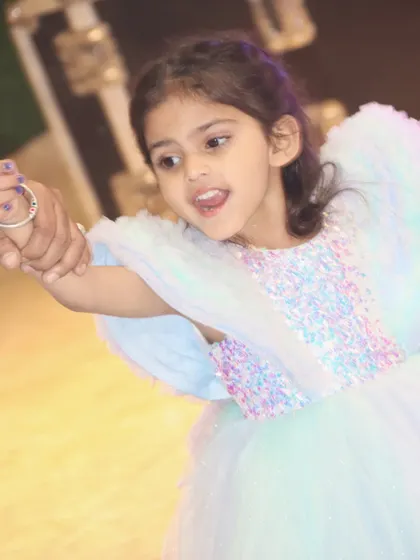 A candid shot of the birthday girl dancing and enjoying her party.