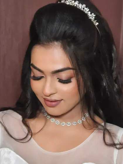 A close-up of a model's eye makeup for a Christian wedding look, with soft, blended shadows and a defined lash line.