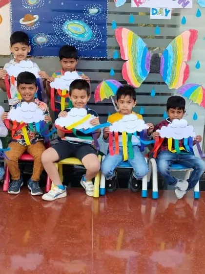 Students with their butterfly-wing themed rainbow crafts, ready to fly into a world of color.