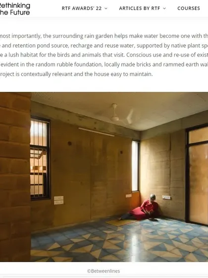 Inside the "Breathe" house, the walls are made of rammed earth and CSEB. The flooring uses handmade Athangudi tiles in a gradient pattern, adding color and craft to the muted, earthy tones of the structure.