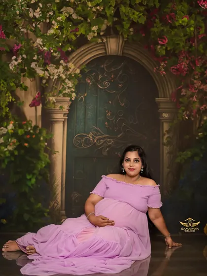 A relaxed, seated portrait on the floor. This pose is comfortable and results in beautiful, natural-looking photos.