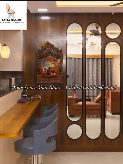 A traditional wooden mandir mounted on the wall, creating a focal point next to the breakfast bar in this open-plan home.
