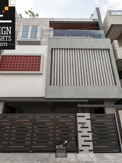 A completed contemporary project, "Isiri Residency," showcasing a modern facade with a mix of textures, including jaali work, vertical fins, and smooth plaster.