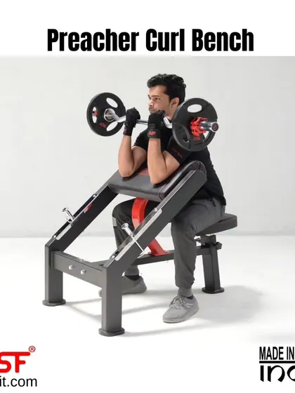 A side view of a user at the peak contraction of a preacher curl.