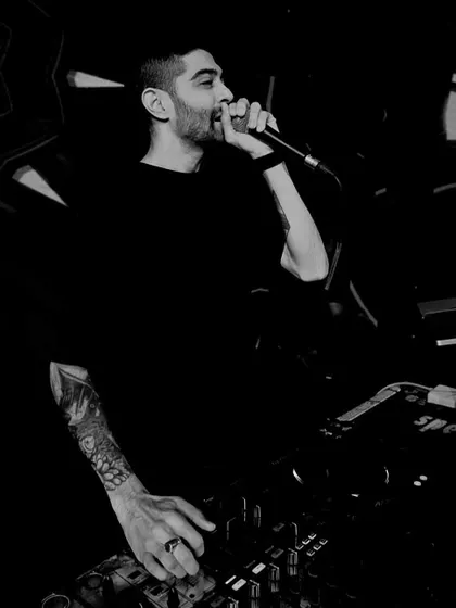 It's not just about playing music; it's about connecting with the crowd. Here I am on the microphone, hyping everyone up and making sure the energy never drops. This is a key part of my live performance style.