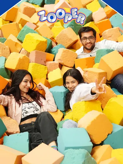 A team enjoying their time in the foam pit. It’s a great spot for laughs and a soft landing after a high-energy activity.