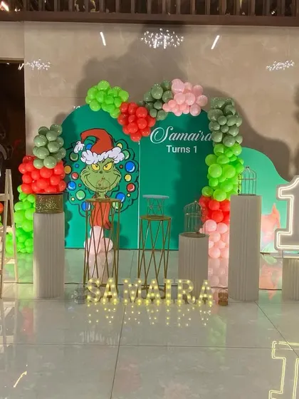 A unique Grinch-themed first birthday party, perfect for a holiday season celebration.