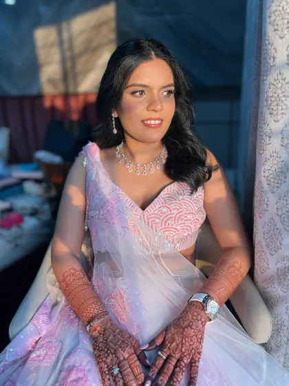 Another shot in the golden hour light, showing off her radiant skin and soft pink makeup.