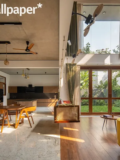 Another image from the Wallpaper* feature, showing the open-plan living and dining area.