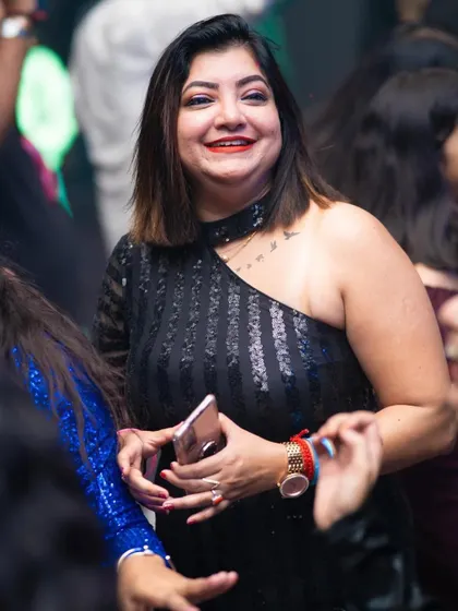 A happy guest enjoying the New Year's Eve celebration.