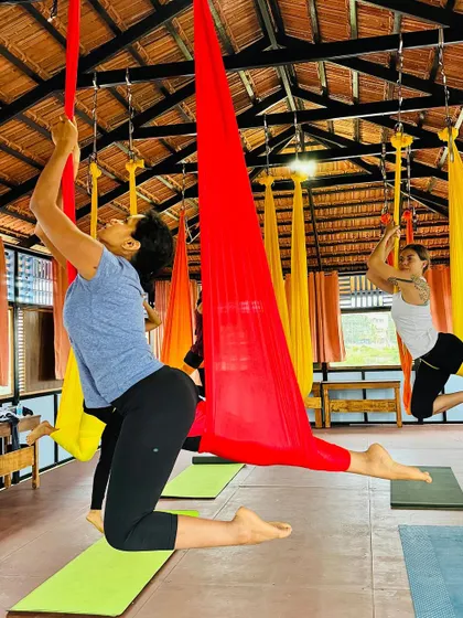 Our Aerial TTC students working hard and aiming for perfection in a supported lunge pose.