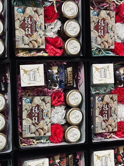 A grid view of our favor boxes, showing the beautiful arrangement of sweets, dry fruits, and flowers inside.