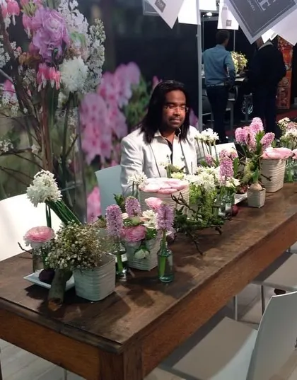Taking a moment at a beautifully decorated table during a floral show in the Netherlands.