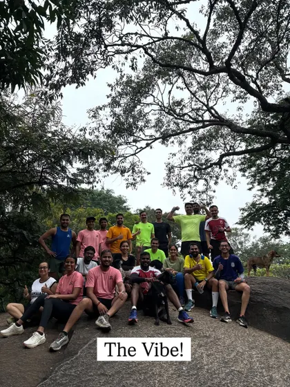 The vibe of our running club after a good run in the Bangalore rain. We're a mix of serious runners and happy faces, always supporting each other.