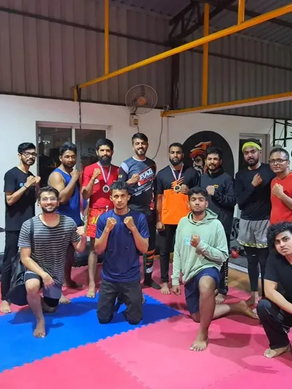 The team gathers to congratulate our fighters after their success at a local expo. We show up to support our own.
