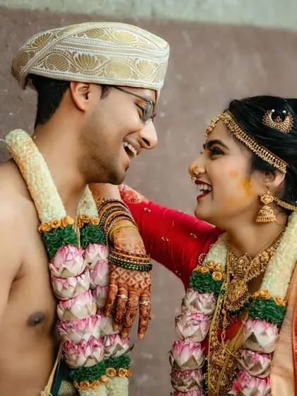 A candid and joyful moment between a couple, laughing together during their wedding. We believe in capturing the fun and friendship in your relationship.