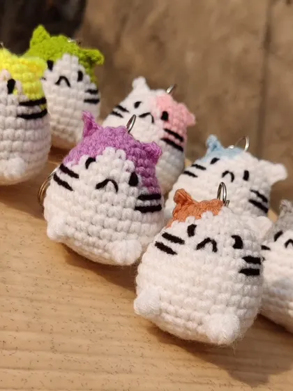 A different angle of the cute cat keychain collection.
