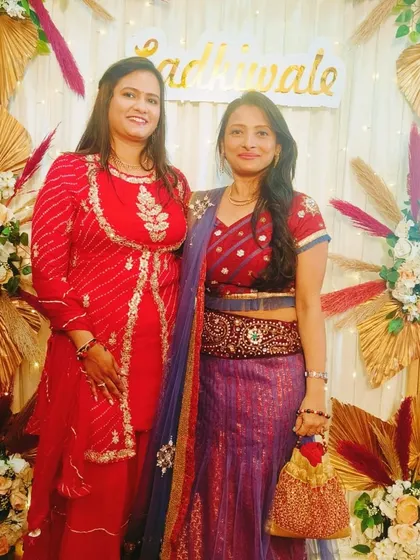 With a guest at the Mamera function for the Parekh family. The decor, with its golden fans and floral arrangements, was designed to create a festive and traditional setting for this important pre-wedding ritual.