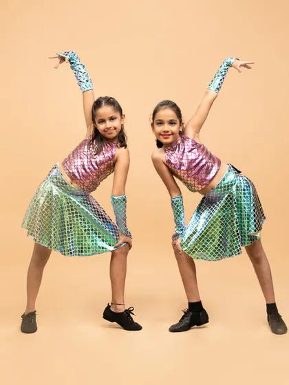 Two of our little mermaids striking a pose. Our themed performances help kids get into character and build their stage presence in a fun, imaginative way.