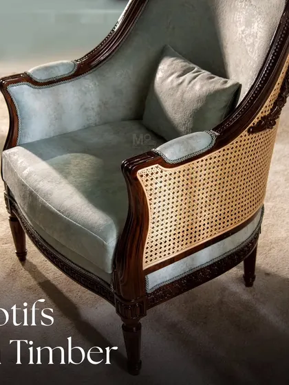 From our 'Motifs on Timber' collection, this armchair fuses traditional chip carving with modern design. The tufted velvet upholstery in a soft pastel tone balances the intricate dark woodwork and classic caning.