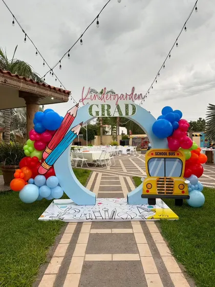 An entrance arch for a kindergarten graduation party. This creates a grand and exciting welcome for the little graduates and their families.