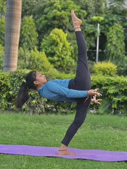 This Pratyanchyasana variation is a standing balance pose that requires incredible leg strength and flexibility. This young yogi makes it look effortless.