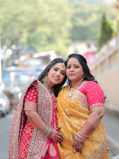 A lovely moment between the bride and her mother. The makeup for both is soft and elegant, enhancing their natural beauty.