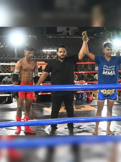 The referee confirms the win. A proud moment for our fighter representing Bengaluru MMA at the South Indian WMC event.