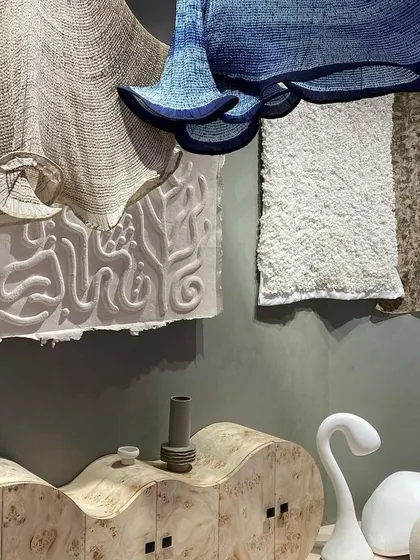 A repeat of image 81, showing a collection of objects and textiles from the 'Shroom' installation.