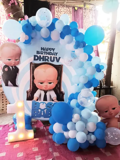 This angle shows the details of the Boss Baby setup, including the balloon arrangement and the placement of the character cutouts and the light-up number one.