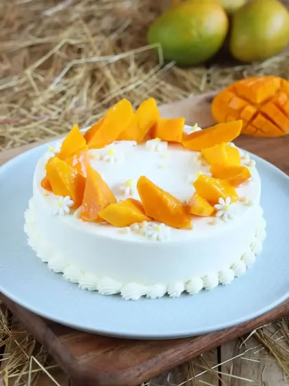This is our French Fresh Cream Mango Floral Cake. It's a light, airy cake that lets the flavor of the fresh mangoes shine through beautifully.