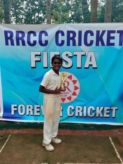 Sohum proudly holds his trophy after scoring a brilliant century in the U13 RRCC tournament, setting up a big win for his team.