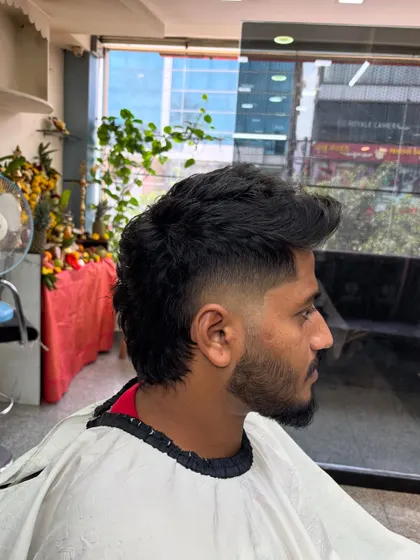 A different view of the same modern mullet, highlighting the fade.
