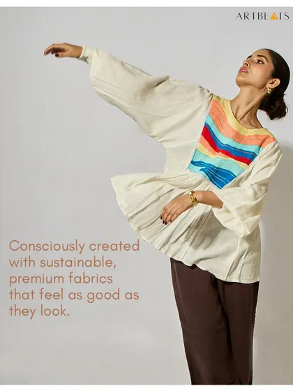Art shouldn’t just hang on walls. It should live, breathe, and walk with you. This image of the Seascape Frill Top captures my core belief in creating clothing that lets you wear a story.